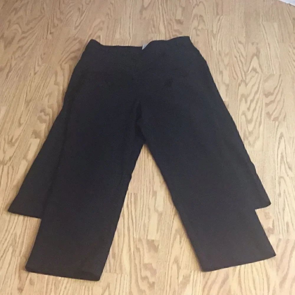 2 pair black stretch type pants in size 12 to 14 petite